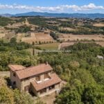 View of farmhouse and surrounding landscape