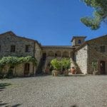 Business for sale in Tuscany Italy comprising hamlet with organic winery, Agriturismo, restaurant, vineyard and olive grove. Villa, farmhouses and outbuildings. 165 hectares of land.