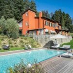 View of pool and Tuscan villa home