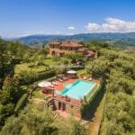 View of villas with pools in Tuscany