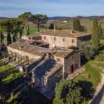 External view of farmhouse with garden for sale in Tuscany Italy