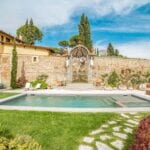 View of pool and 17th century fountain at luxury Florence villa for sale