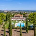 View of pool and Tuscan villa for sale
