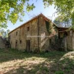 External view of fixer upper farmhouse in Italy
