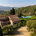 View of Tuscan farmhouse and pool