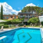 Pool view of luxury Tuscan home.