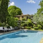 Pool view of restored Umbria farmhouse property
