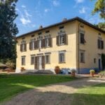 External view of historic luxury Tuscan villa.