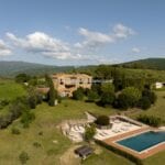 Aerial view of large Tuscan villa and surroundings