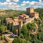 Aerial view of Tuscan medieval castle property and hamlet near Castiglione d’Orcia Tuscany Italy