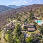 View of farhmhouse and converted barn guesthouse, garden and pool in Umbria near Umbertide and Città di Castello