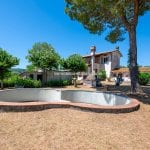 External view of villa and pool for sale in Rural Tuscany.