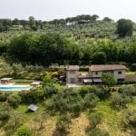 View of modern villa, guesthouse and pool and gardens, Assisi Umbria Italy