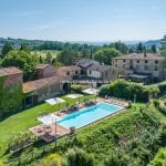 View of agriturismo, buildings, land and pool near Anghiari Tuscany Italy for sale.