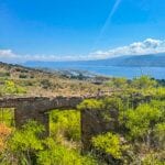 View of ruined farmhouse, land and seaview Messina, Sicily, Italy