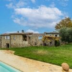 External view of restored energy efficient farhouse and swimming pool Arcidosso Grosseto Tuscany Italy