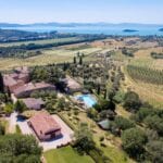 View of restored rural Italian village boutique hotel buildings and surroundings including view of Lake Trasimeno Tuoro sul Trasimeno Umbria