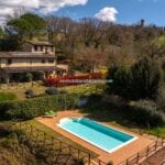 View of large farmhouse home near Todi Umbria Italy show pool, gardens and surroundings