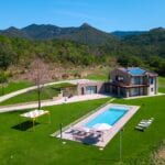 View showing modern villa home, pool and gardens Regello Florence Tuscany Italy