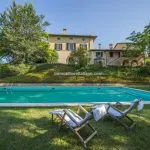 Pool view of historic luxury villa with unique Roman mosaic floor Città di Castello Umbria Italy