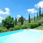 Arezzo Tuscany panoramic villa for sale. Lovely large (8 bedrooms) fully restored property with great hill top panoramic views, pool, gardens and olive grove.