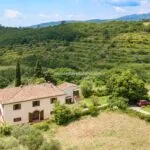 Aerial view of Tuscan farmhouse for sale and surroundings