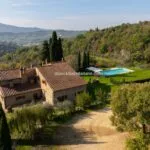 View of Tuscan farmhouse and pool