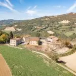 View of Italian farm hamlet fixer upper renovation project.