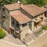 External view showing renovated farmhouse, and pool, Loro Ciuffenna Tuscany Italy