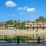 View of Tuscan resort and fishing lake.