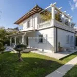 View of Tuscan villa near beach.