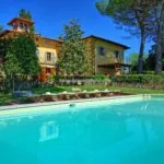 External view of luxury Tuscan villa and pool