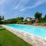 View of pool and Citerna Umbria Italy villa and gardens
