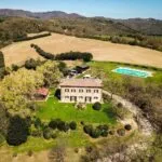 Aerial view of Farmhouse home with pool and garden, Corciano Umbria Italy