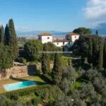 View of Tuscan estate near Florence taking in the Villa, pool and surroundings