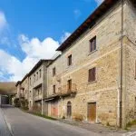 External view of former hotel for commercial or residential development Capres Michelangelo Tuscany Italy