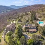 View of farhmhouse and converted barn guesthouse, garden and pool in Umbria near Umbertide and Città di Castello