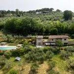 View of modern villa, guesthouse and pool and gardens, Assisi Umbria Italy