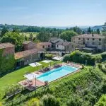 View of agriturismo, buildings, land and pool near Anghiari Tuscany Italy for sale.