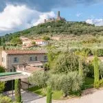 View of Tuscan restored farmhouse and Montecchio