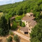 Aerial view of large farmouse, outbuildings and land for sale Greve in Chianti Tuscany Italy