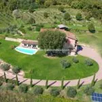 Aerial view showing farmhouse and pool on small estate Bibbiena Arezzo Tuscany Italy
