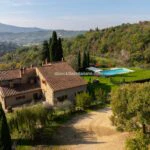 View of Tuscan farmhouse and pool