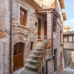 View of Anghiari Tuscany historic alley and townhouse home