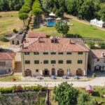 View of Tuscan hamlet with mansion house of distinction, hotel, pool and gardens Sansepolcro Arezzo Tuscany Italy