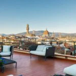 View from roof terrace showing Duomo views Florence palazzo apartment building Tuscany Italy