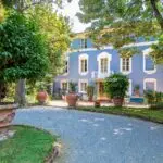 Entance view showing facade of historic villa in Tuscany