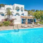 External view of Italian coastal villa and pool