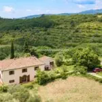 Aerial view of Tuscan farmhouse for sale and surroundings