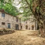 External view of Italian country home and barn